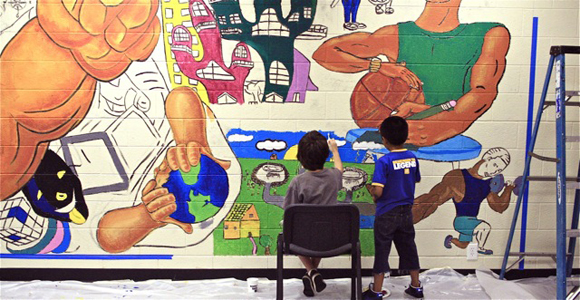 Students painting a classroom mural